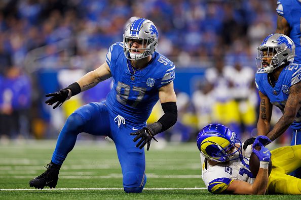Aidan Hutchinson #97 of the Detroit Lions celebrates after a tackle during an NFC Wild Card Playoff football game against the Los Angeles Rams at Ford Field on January 14, 2024 in Detroit, Michigan.