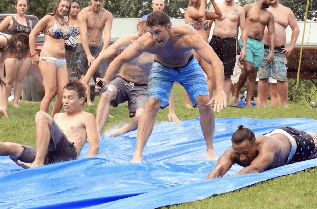 campers enjoy a slip and slide