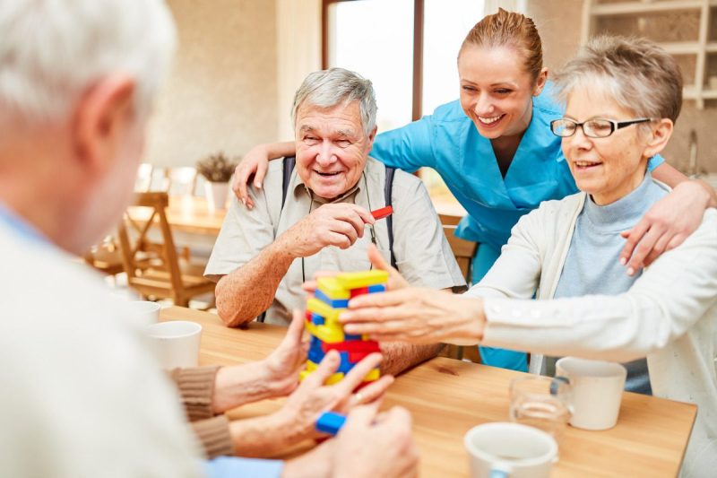 Seniors and nurse at health care at a assisted living community