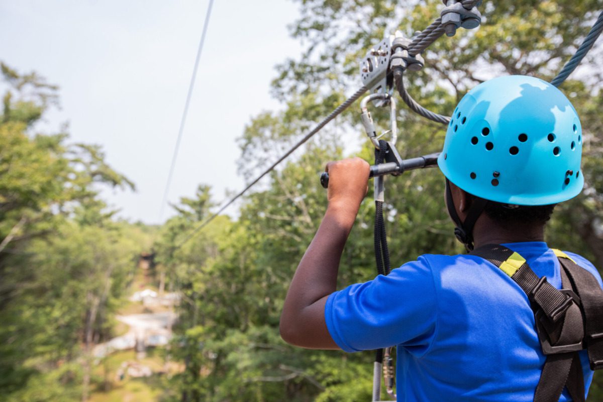 person using the Muskegon Luge Adventure Sports Park Duo Zipline