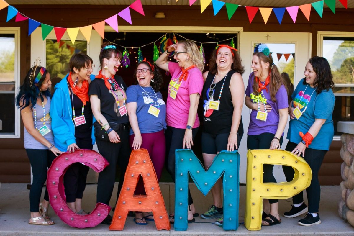 attendees laughing at Camp Stratejoy