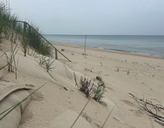 Half-buried sandbags line the front of a property in Lake Charter Township in Southwest Michigan. The water has dropped to below-average levels, but many residents are keeping their defenses in place for the inevitable rise.